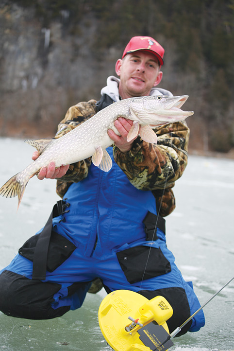 fisherman with big pike