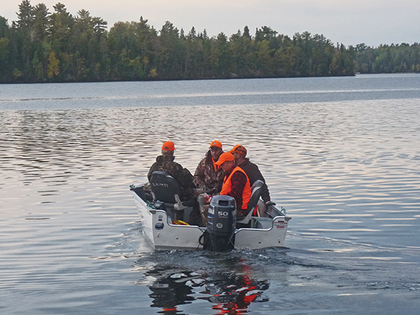 heading out in a boat to hunt whitetail deer on small islands