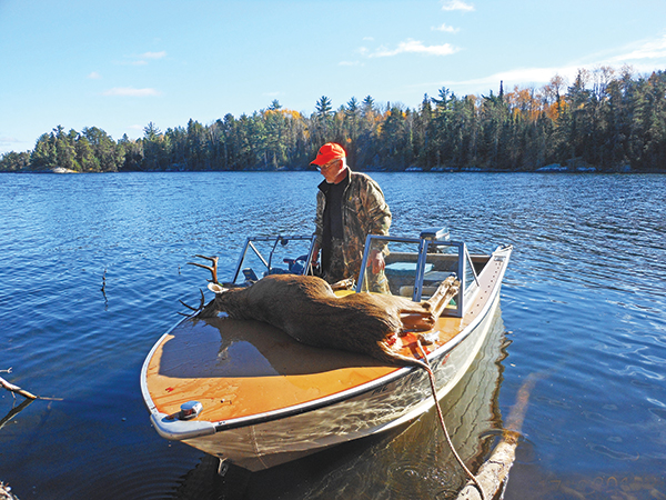 heading back to shore with a trophy buck on the boat