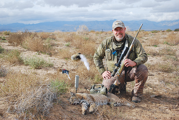 hunter with a bobcat he called and killed